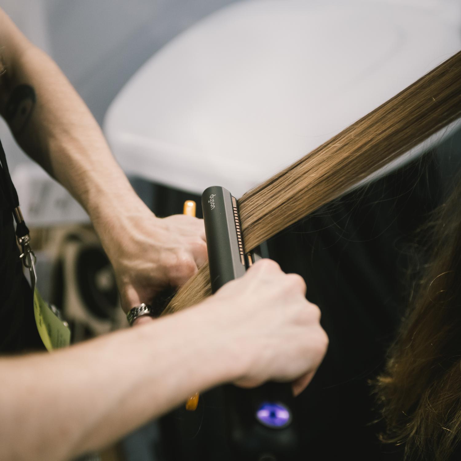The Dyson Corrale straightener being used at Paris Fashion Week.